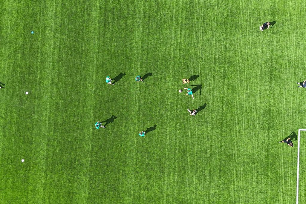 Aerial view of players during a match at Crown Highways' charity football tournament