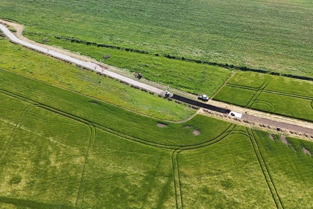 Aerial view of the new access road being built through fields at Charlotte's Kids Village
