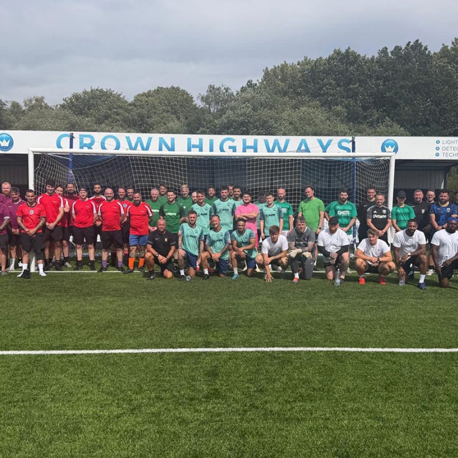 Teams line up in front of the goal at Crown Highways' third annual charity football tournament